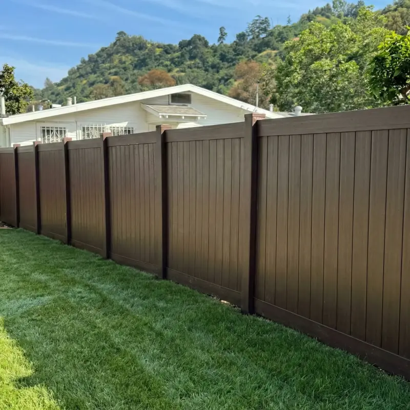 Durable Composite Fencing Panels In Dark Wood Grain Texture Featuring A Classic FlatTop Design For Home Privacy