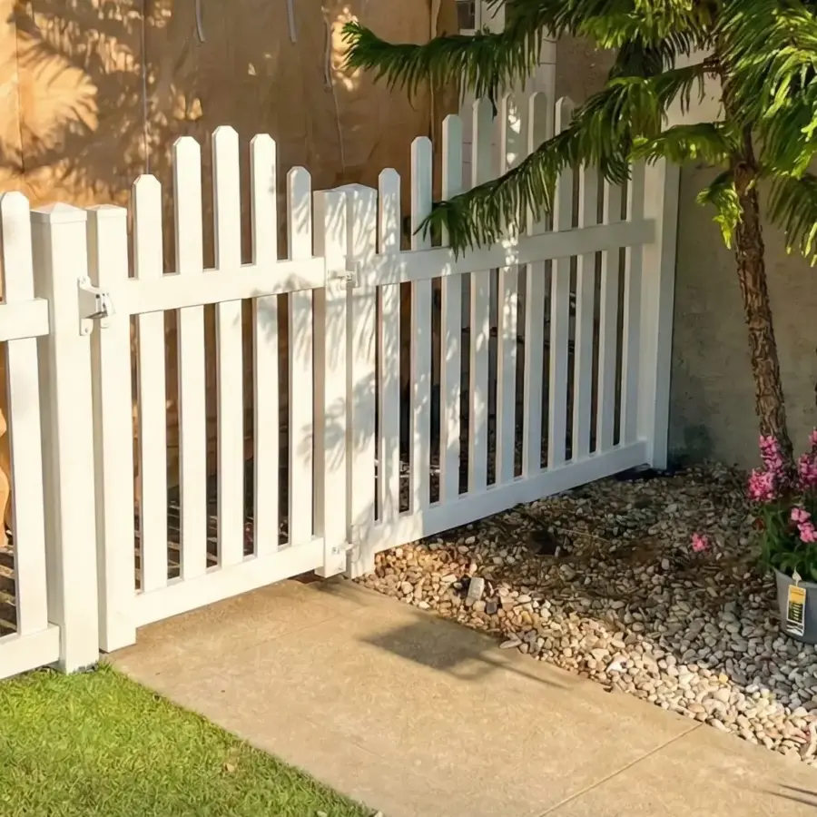 Green Artificial Grass Lawn In A Sunny Backyard Bordered By A White Fence And Mature Palm Trees 2