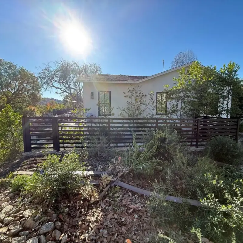 Sloped Backyard Perimeter With Horizontal Aluminum Fencing